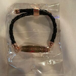 New sealed black braided bracelet w motivational words “empower embrace elevate”